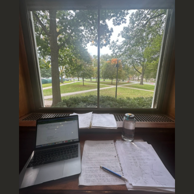 A desk working station with an open window looking out to the Green. 